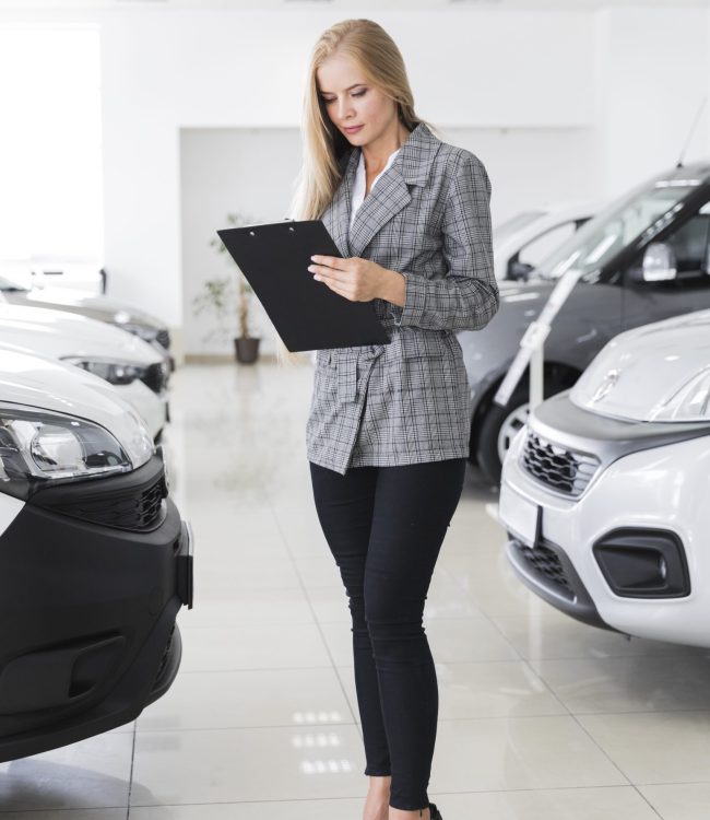 young-female-dealer-looking-file